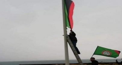 بالفيديو: مناصرو "أمل" يستبدلون علم ليبيا بعلم "الحركة " image