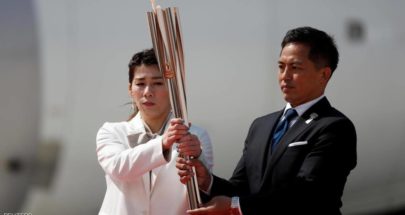 الشعلة الأولمبية تصل اليابان وسط مخاوف من كورونا image