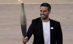 اليونان تسلّم الشعلة الأولمبية للمنظمين الفرنسيين image