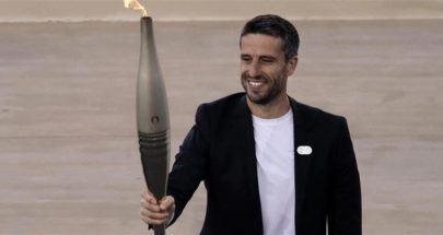 اليونان تسلّم الشعلة الأولمبية للمنظمين الفرنسيين image